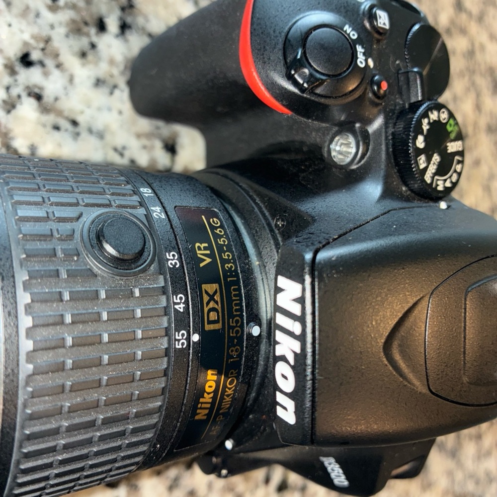 Nikon Black Digital Camera with Ergonomic Design and Professional Lens